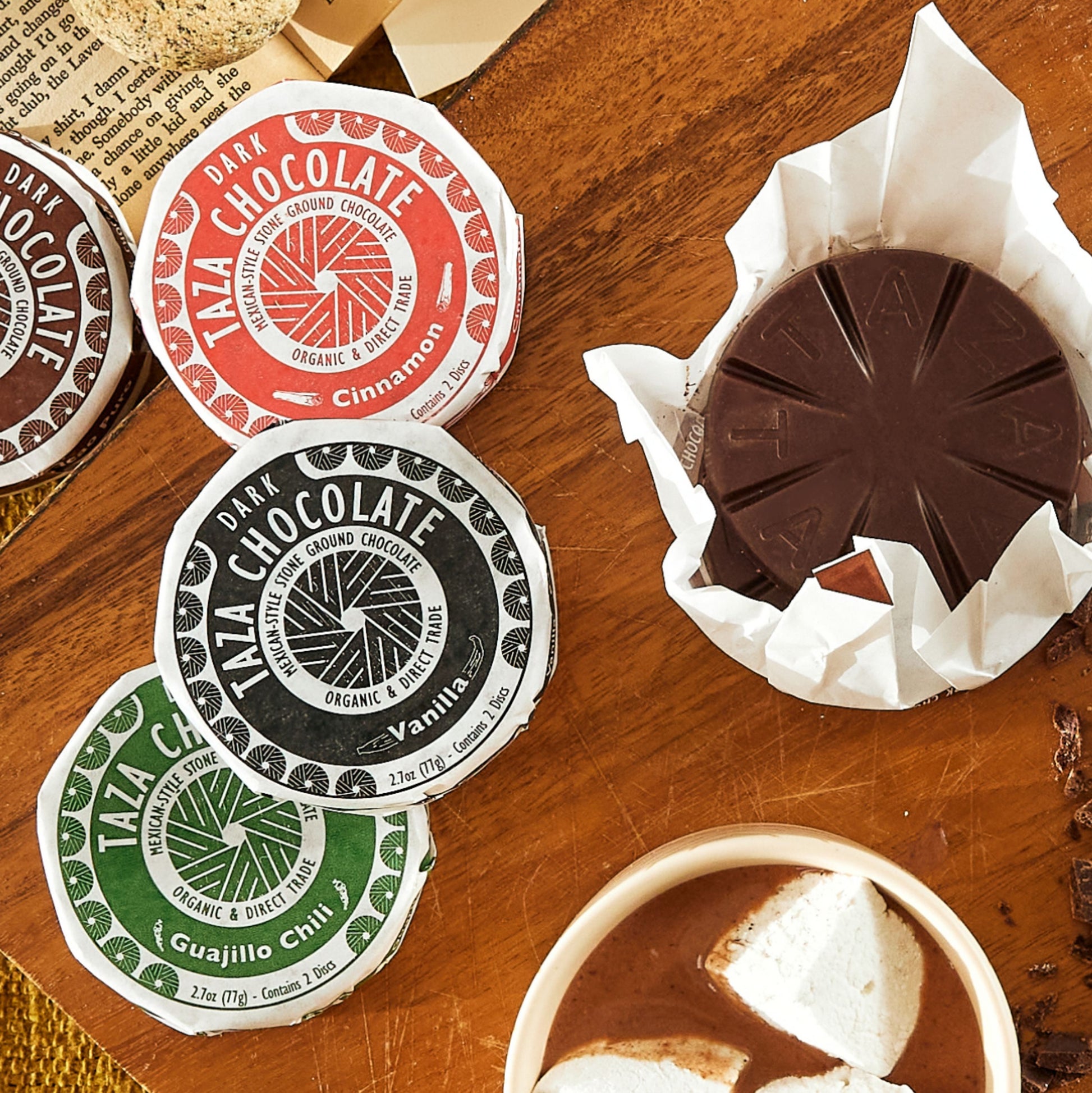 Cinnamon Chocolate Disc lying near unwrapped chocolate.