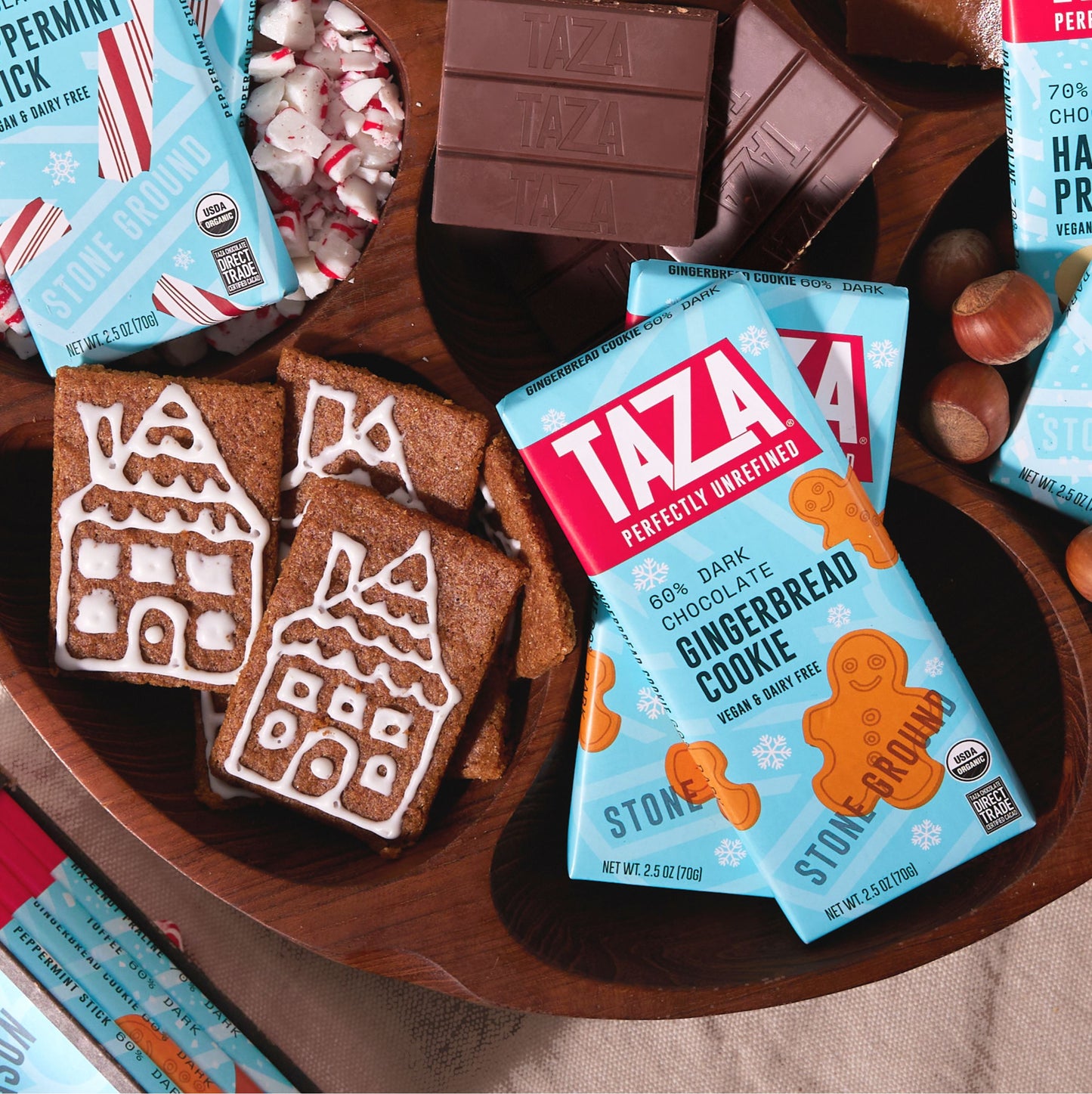 Closeup of Ginger Bread Cookie Bar, unwrapped chocolate, and ginger bread cookies.