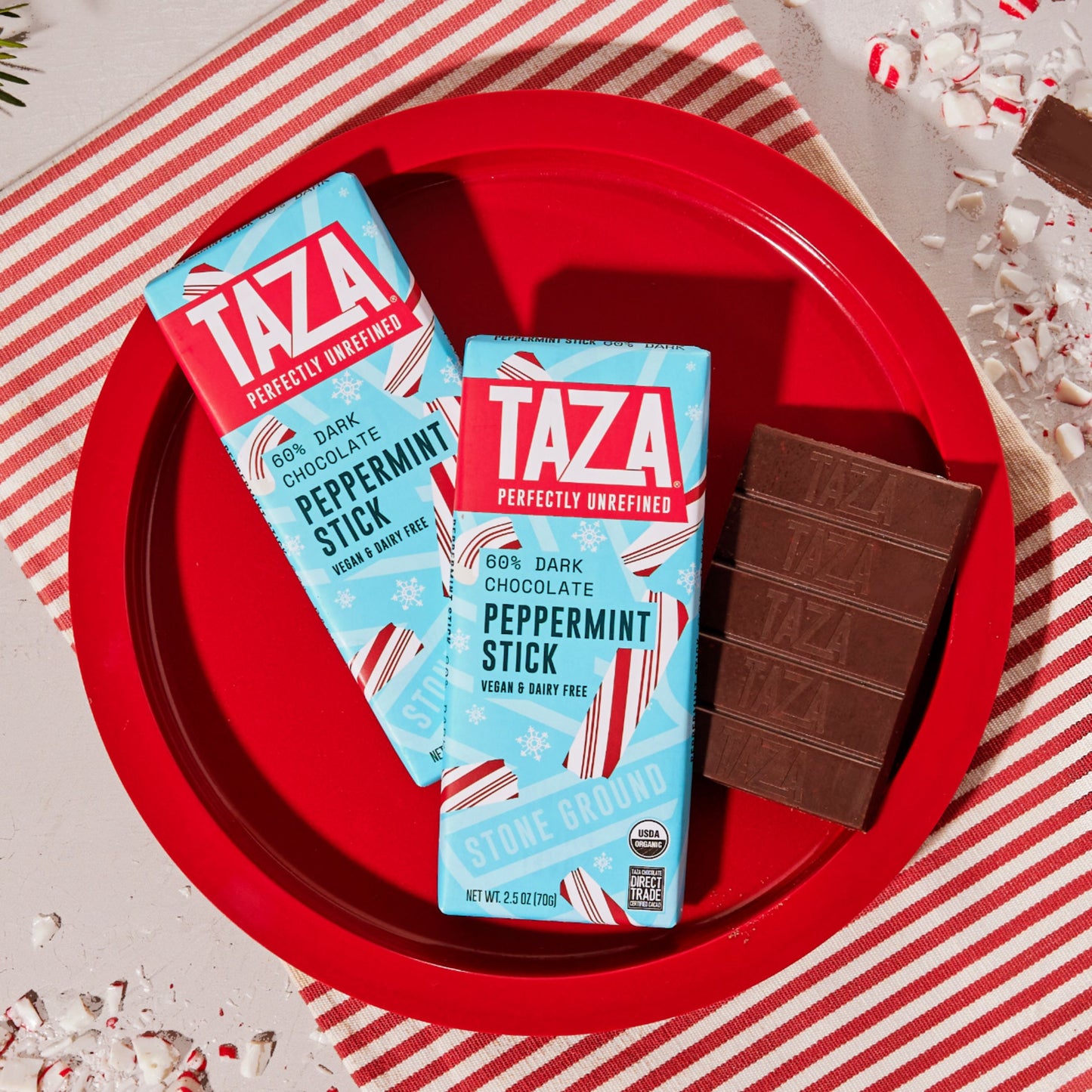 Wrapped and unwrapped Peppermint Stick Chocolate on a peppermint themed holiday backdrop.