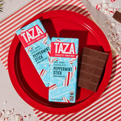 Wrapped and unwrapped Peppermint Stick Chocolate on a peppermint themed holiday backdrop.