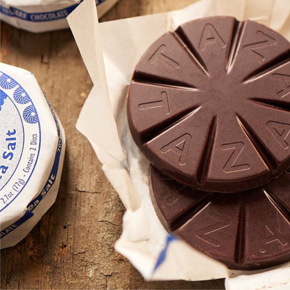 Closeup of unwrapped Sea Salt Chocolate Disc.