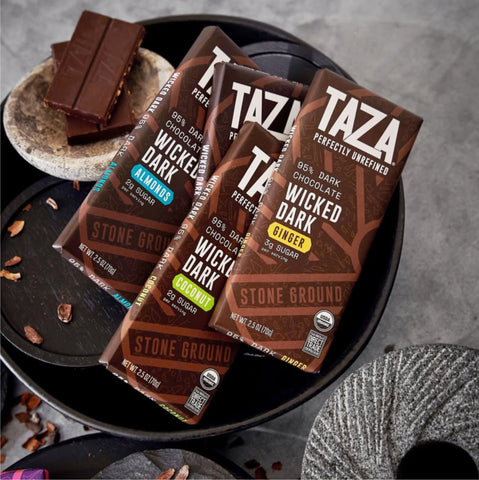 Wicked Dark Almond bar surrounded by similar bars and unwrapped chocolate.